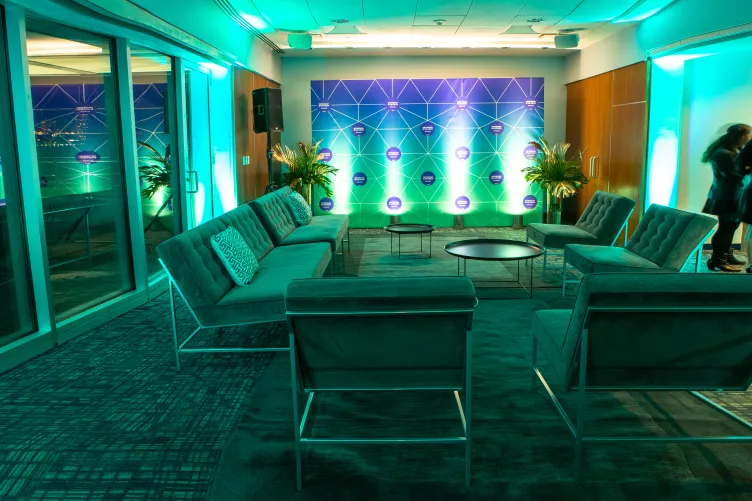 Couches and armchairs in the VIP Room with ambient lighting