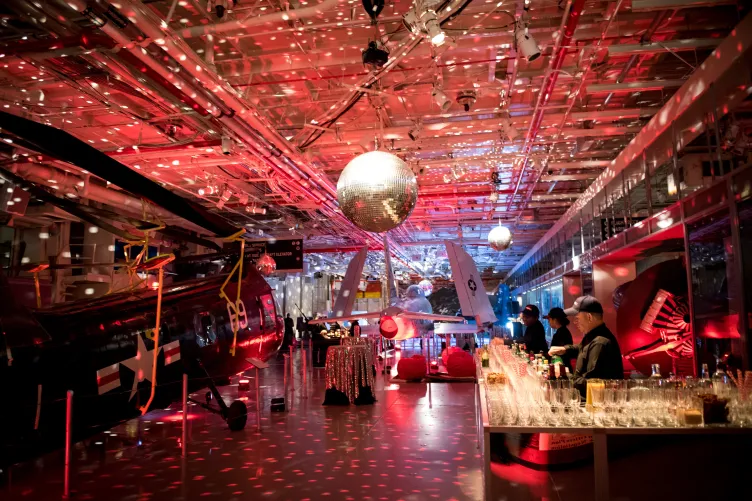 Hangar 2 set for a cocktail reception with a disco ball