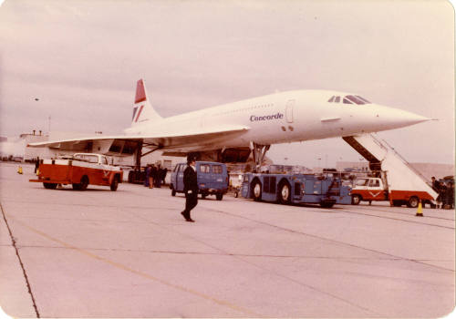 British Airways Concorde docked with cargo around it.
