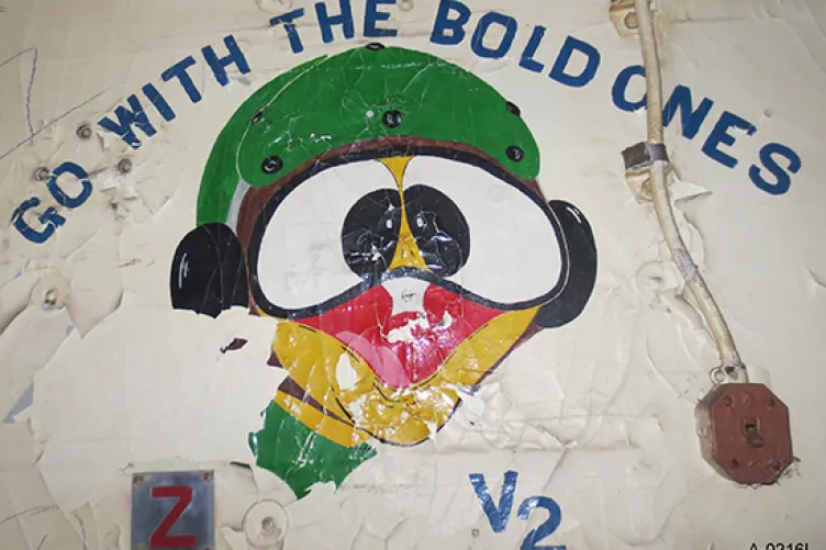V-2 Division’s duck mascot and motto