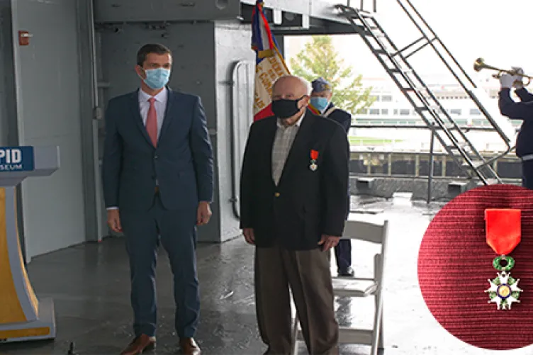 The french consulate holding their legion of honor ceremony at the intrepid museum