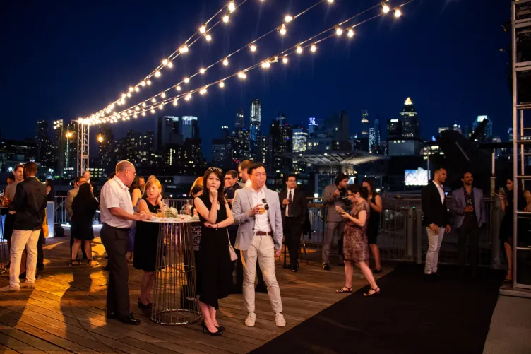 People having a drink at the Port Side Aircraft Elevator during an event