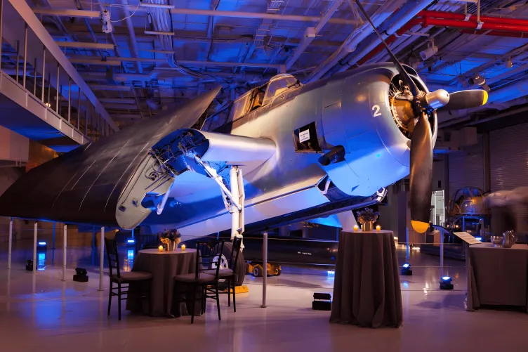 Tables and lighting set in Hangar 2 for a cocktail reception