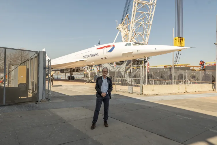 Leslie Scott, a British Airways Concorde pilot, standing in front of the Concorde.