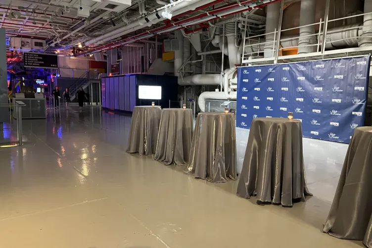 Hangar 1 set up with a step and repeat banner