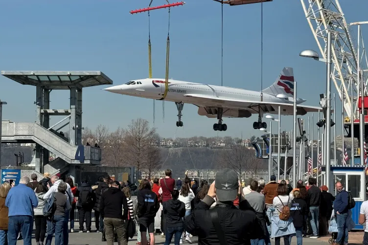 Museum visitors gathered on pier 86 watching British Airways Concorde arrival back to the Museum