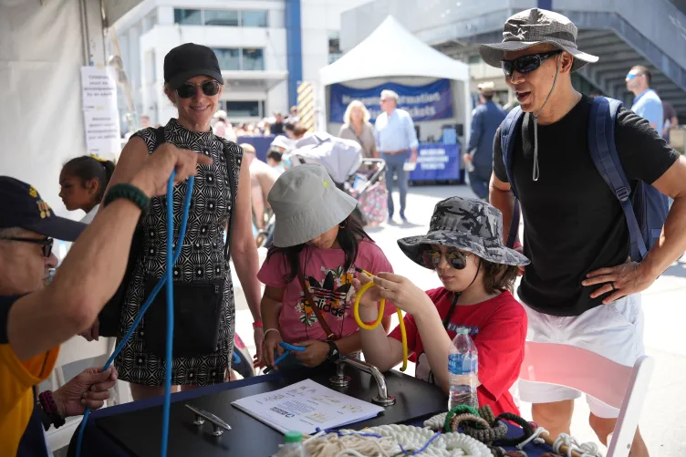 Visitors participating in Fleet Week activities on Pier 86 at the Intrepid Museum