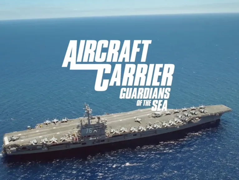 An aircraft carrier in the ocean with text that says Aircraft Carrier Guardian of the Seas.