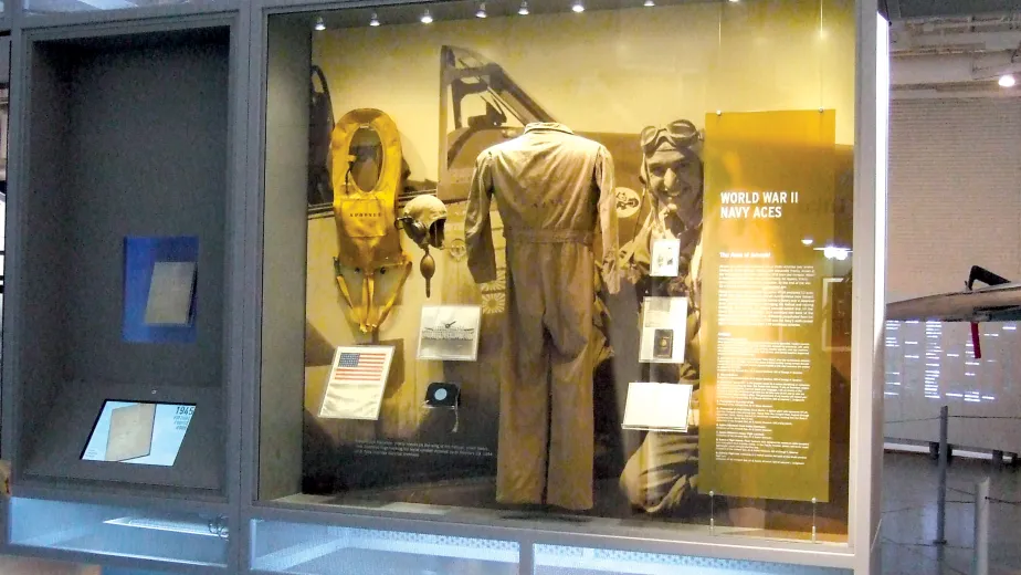 A display case showing a uniform with the headline that reads "World War II Navy Aces"