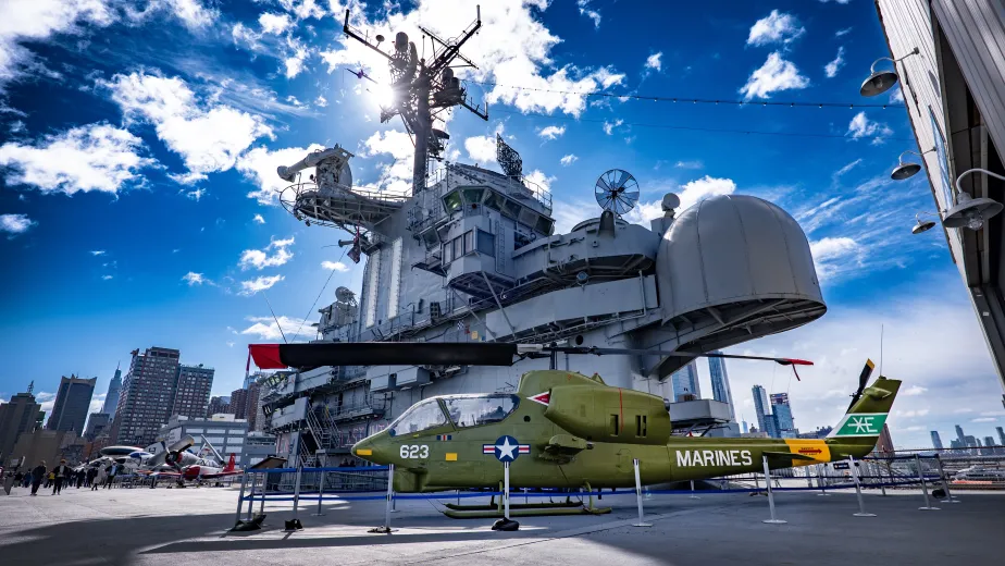 Image of the aircraft carrier Intrepid at Pier 86 on a sunny day.