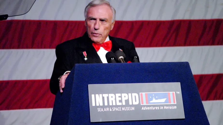 Arnold Fisher, the former chairman of the intrepid museum giving a speech