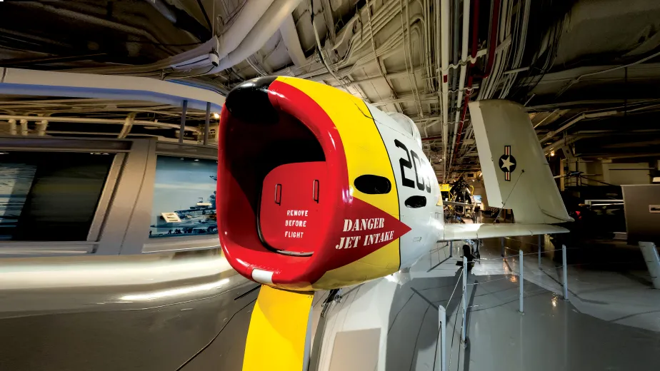 Red and Yellow FJ-3 Fury Aircraft display at the hangar deck